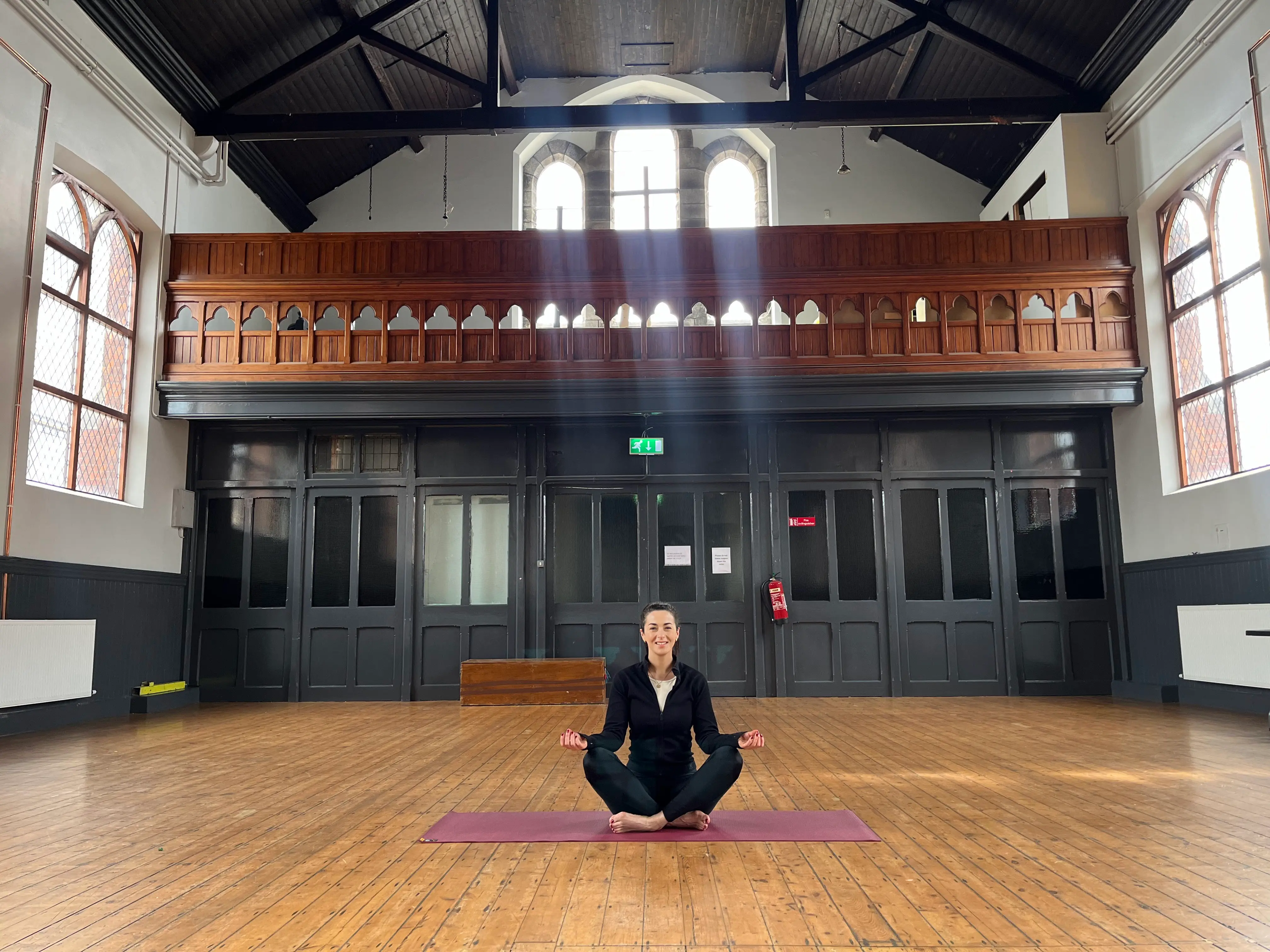 Mary Duffy, certified yoga instructor, demonstrating a yoga pose with calm and professional guidance
